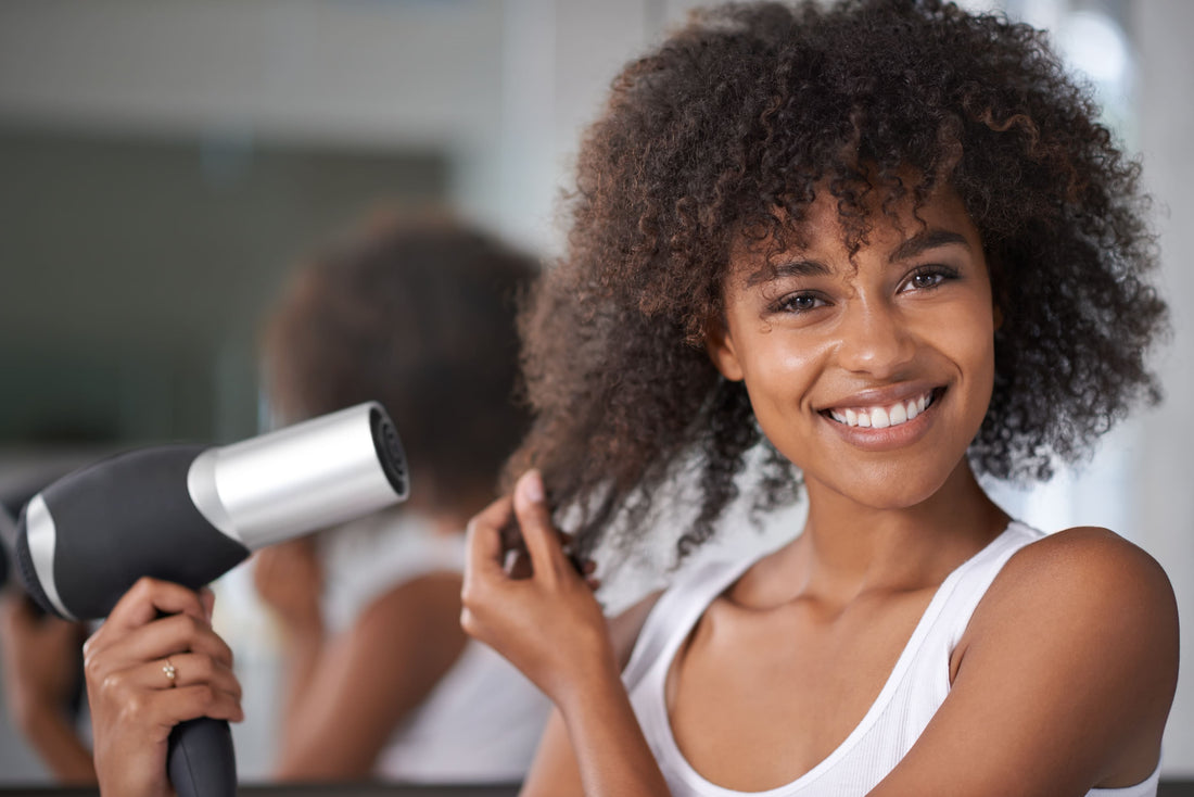 How To Dry Curly Hair: Woman Blow Drying Natural Curly Hair
